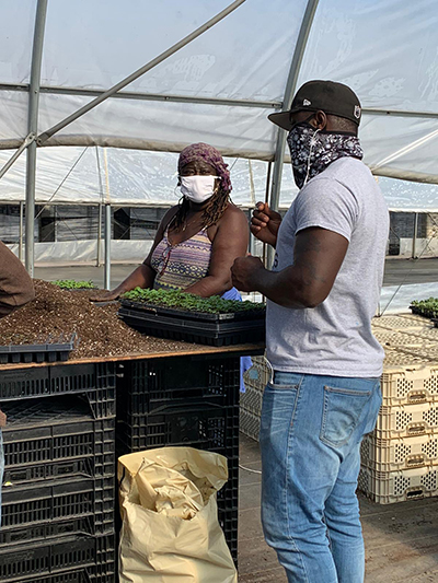 Carlington training one of our workers
